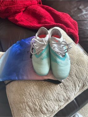 Nike Kids Light Teal Soccer Sneakers with Orange Swoosh